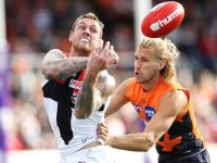 CANBERRA, AUSTRALIA - MAY 04: Tim Membrey of the Saints hand balls under pressure from Harry Himmelberg of the Giants during the round seven AFL match between the Greater Western Sydney Giants and the St Kilda Saints at Manuka Oval on May 04, 2019 in Canberra, Australia. (Photo by Mark Kolbe/Getty Images)